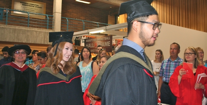 Kinesiology graduation hoods are sage green.